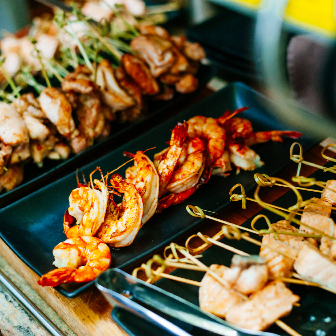 Perfectly grilled seafood with lemon and herbs on a charcoal grill