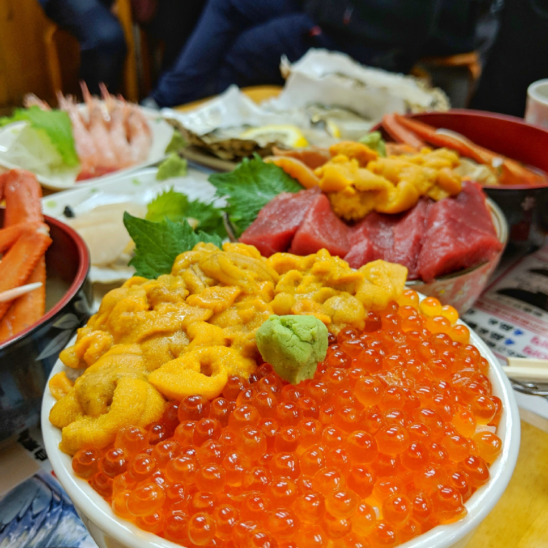 Ikura potato salad topped with salmon roe and fresh dill served in a white bowl