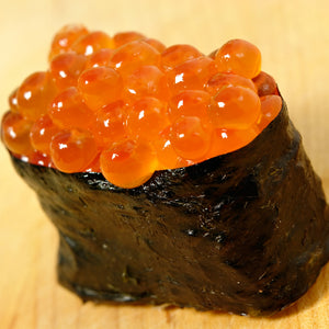 Golden Crispy Ikura Fritters on a plate, showcasing the perfect blend of crunchy exterior with the rich, umami flavor of salmon roe inside