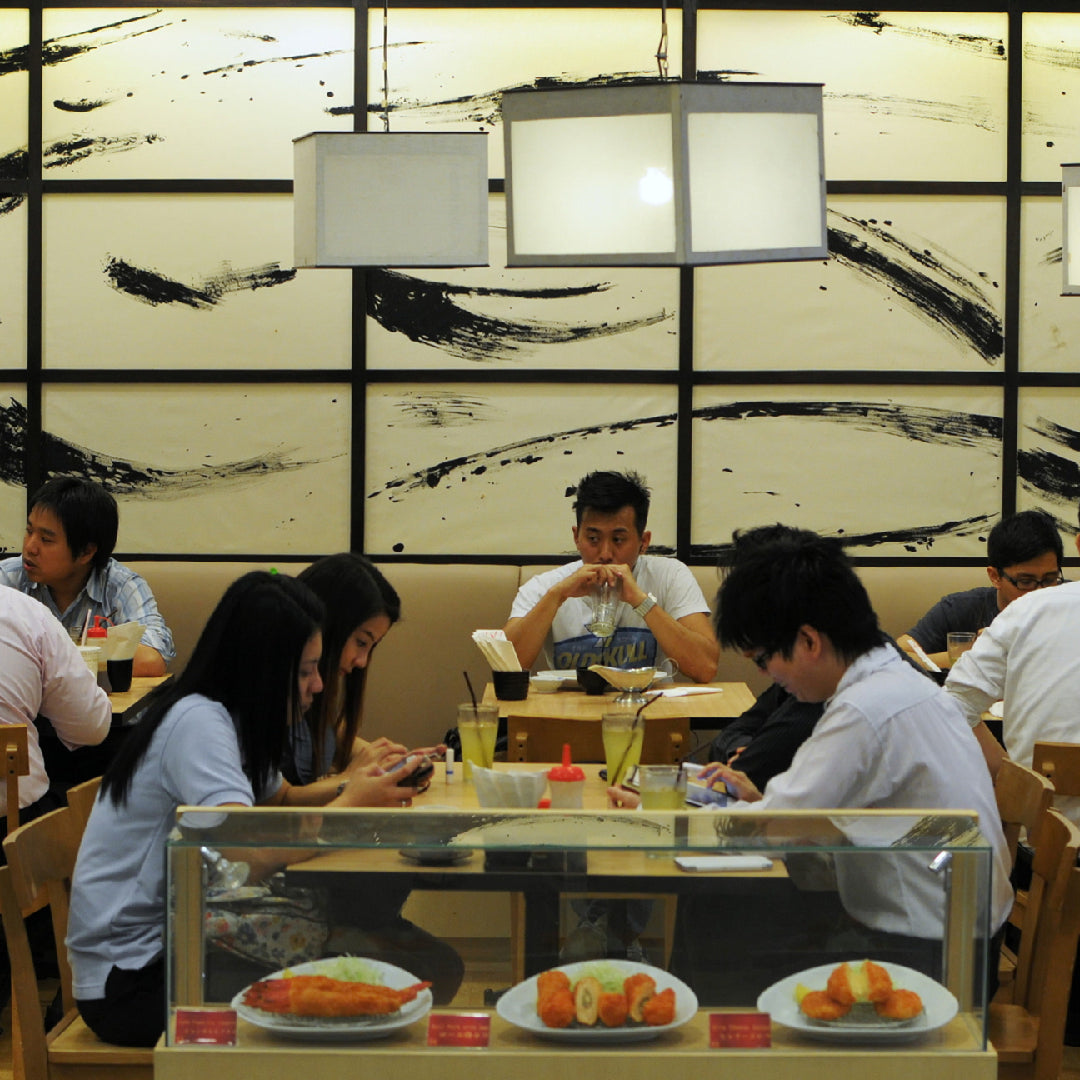 Elegant Japanese restaurant interior in NYC with sushi platter and traditional decor