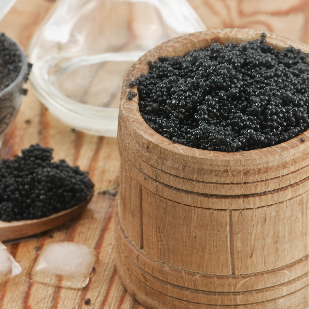 Kaluga caviar gift set with tin, mother-of-pearl spoon, and Champagne on ice