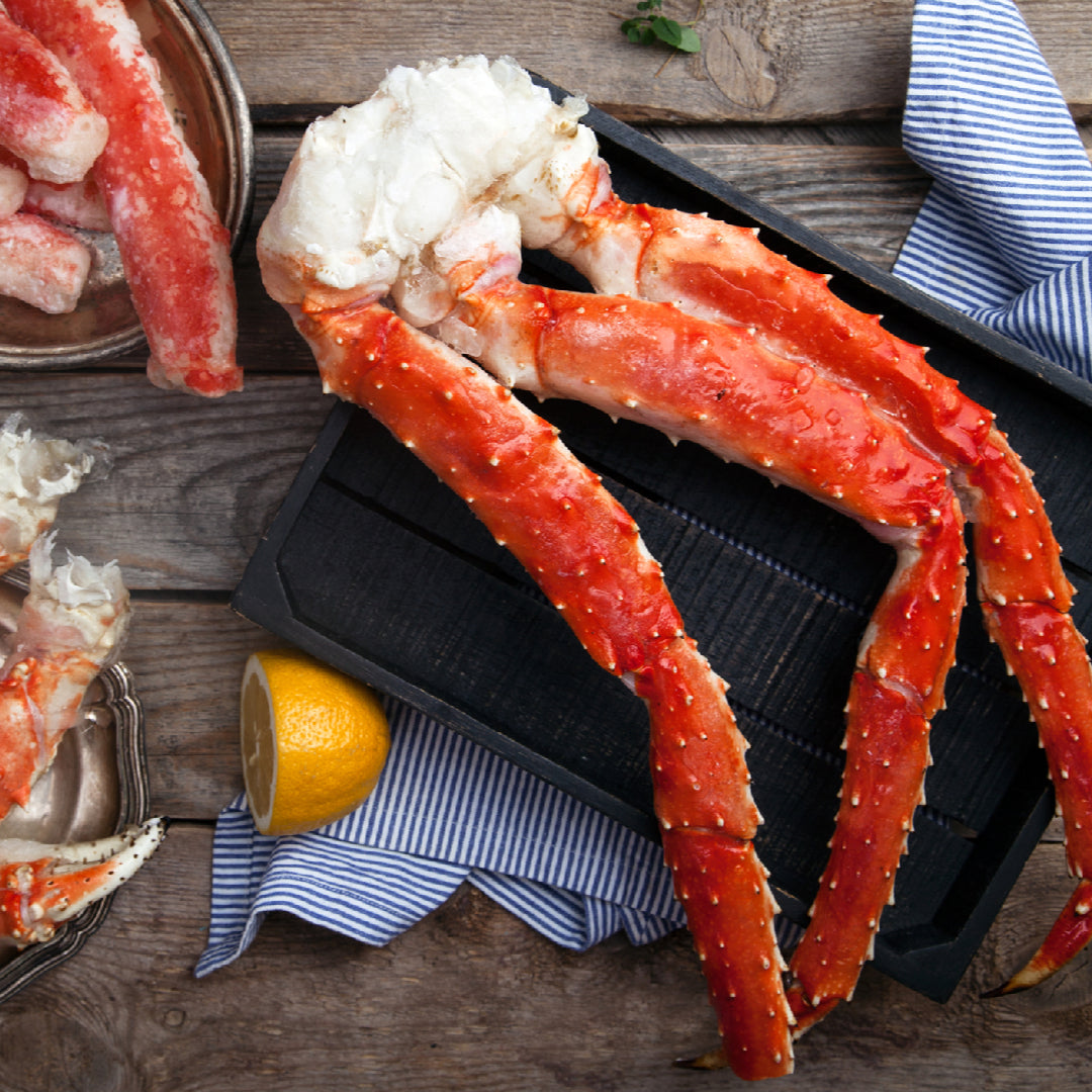 King crab legs elegantly plated for an Easter holiday feast with lemon and butter