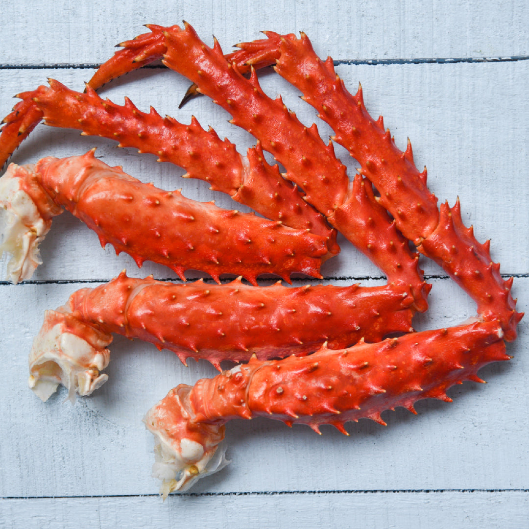 King crab legs on a plate — one of the most nutrient-dense seafood options available, with approximately 17g of lean protein, very low fat, and exceptional levels of vitamin B12, zinc, and selenium per 3-oz serving
