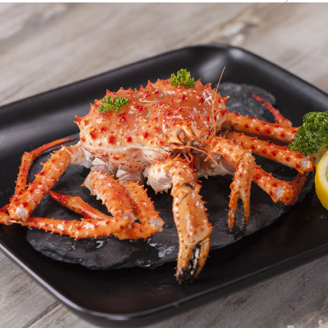 Fresh king crab legs on ice ready for purchase