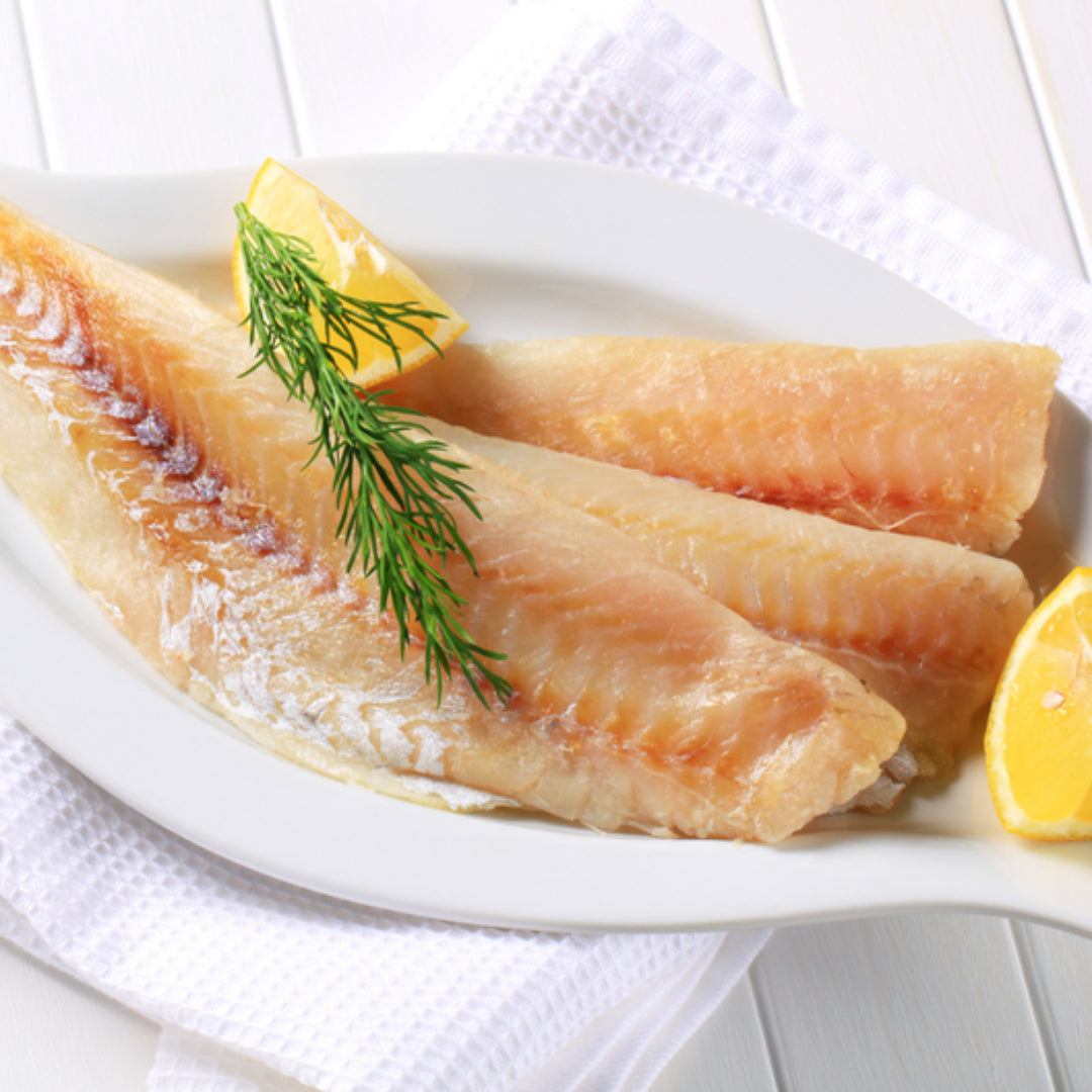 Alaskan pollock fillets on a sustainable seafood display with ocean background and MSC certification badge