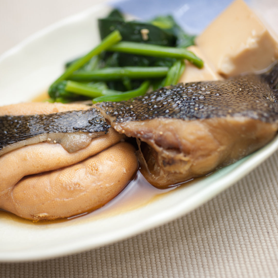 Fresh Petrale Sole fillet on a plate with lemon, herbs, and olive oil, highlighting its omega-3 and protein-rich nutritional profile