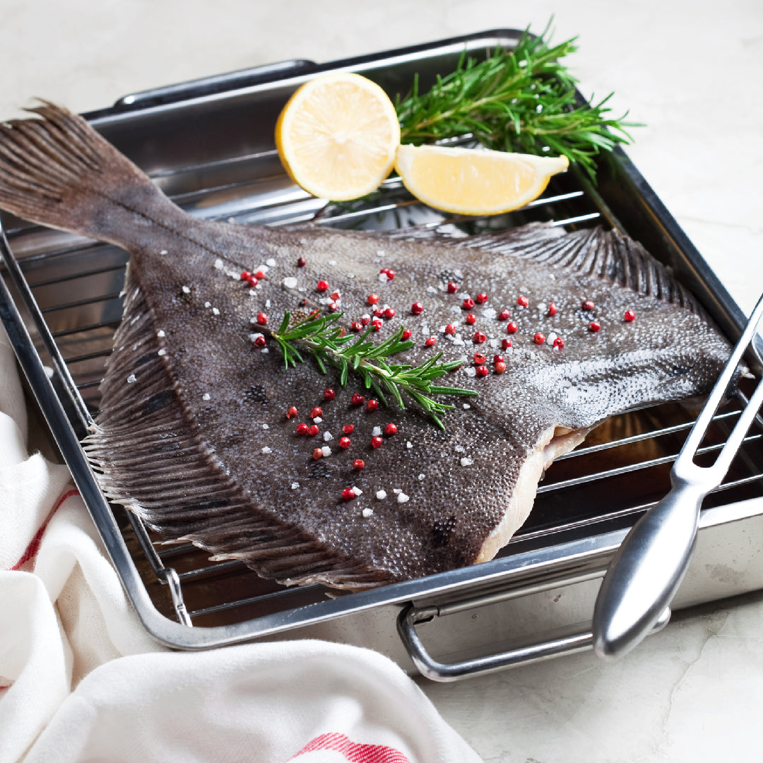 Child-friendly Petrale sole dish with lemon butter sauce served alongside mashed potatoes and vegetables