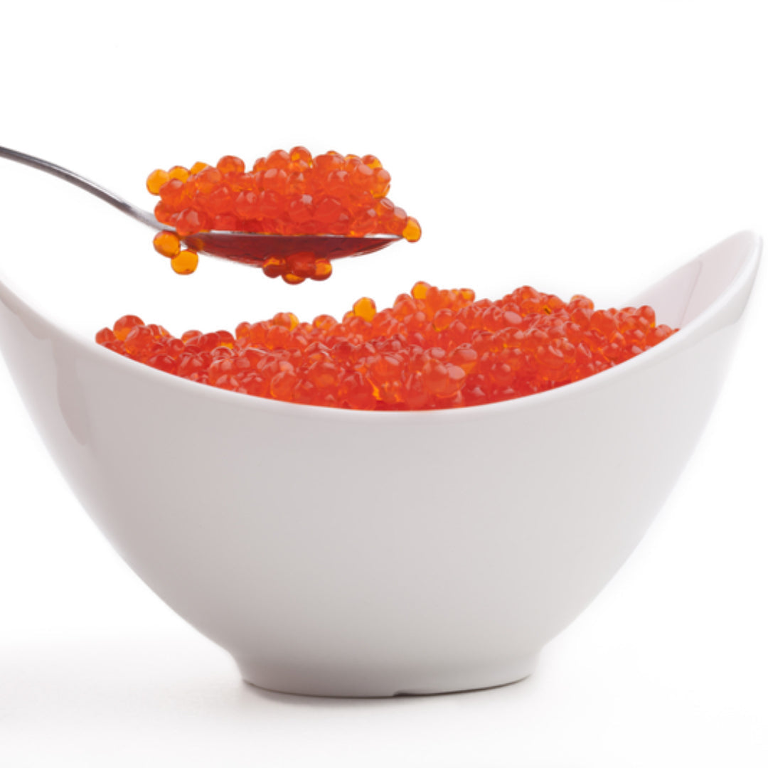 Ikura sushi (salmon roe sushi) on a wooden board showing bright orange chum salmon roe pearls on seasoned sushi rice wrapped in nori
