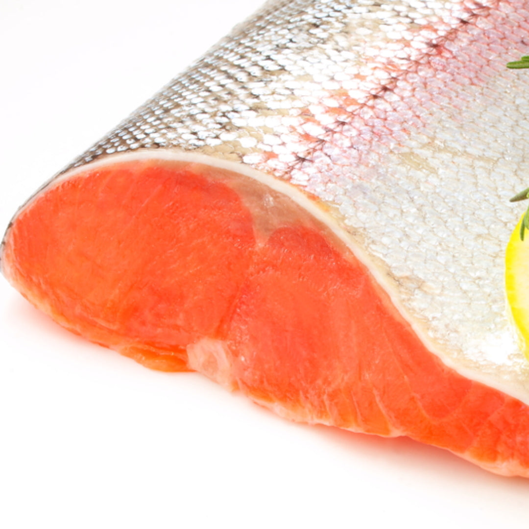 Fresh wild-caught red sockeye salmon fillet showing the deep red-orange flesh and firm texture characteristic of wild Alaskan sockeye