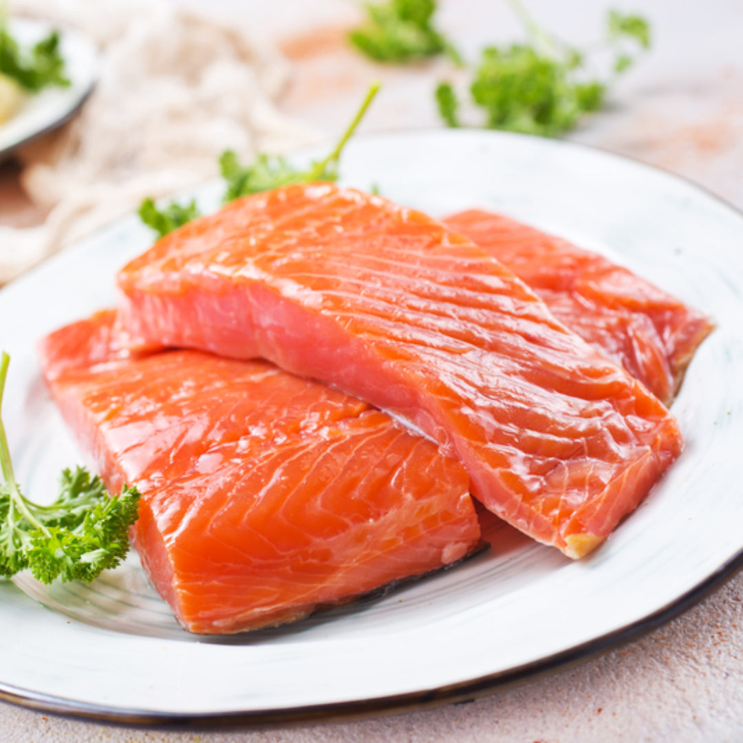 Sockeye red salmon (Oncorhynchus nerka) – wild-caught Alaskan red salmon fillet showing the characteristic deep red flesh from astaxanthin in a krill-rich diet, with bold rich flavor and firm texture ideal for grilling, baking, and pan-searing