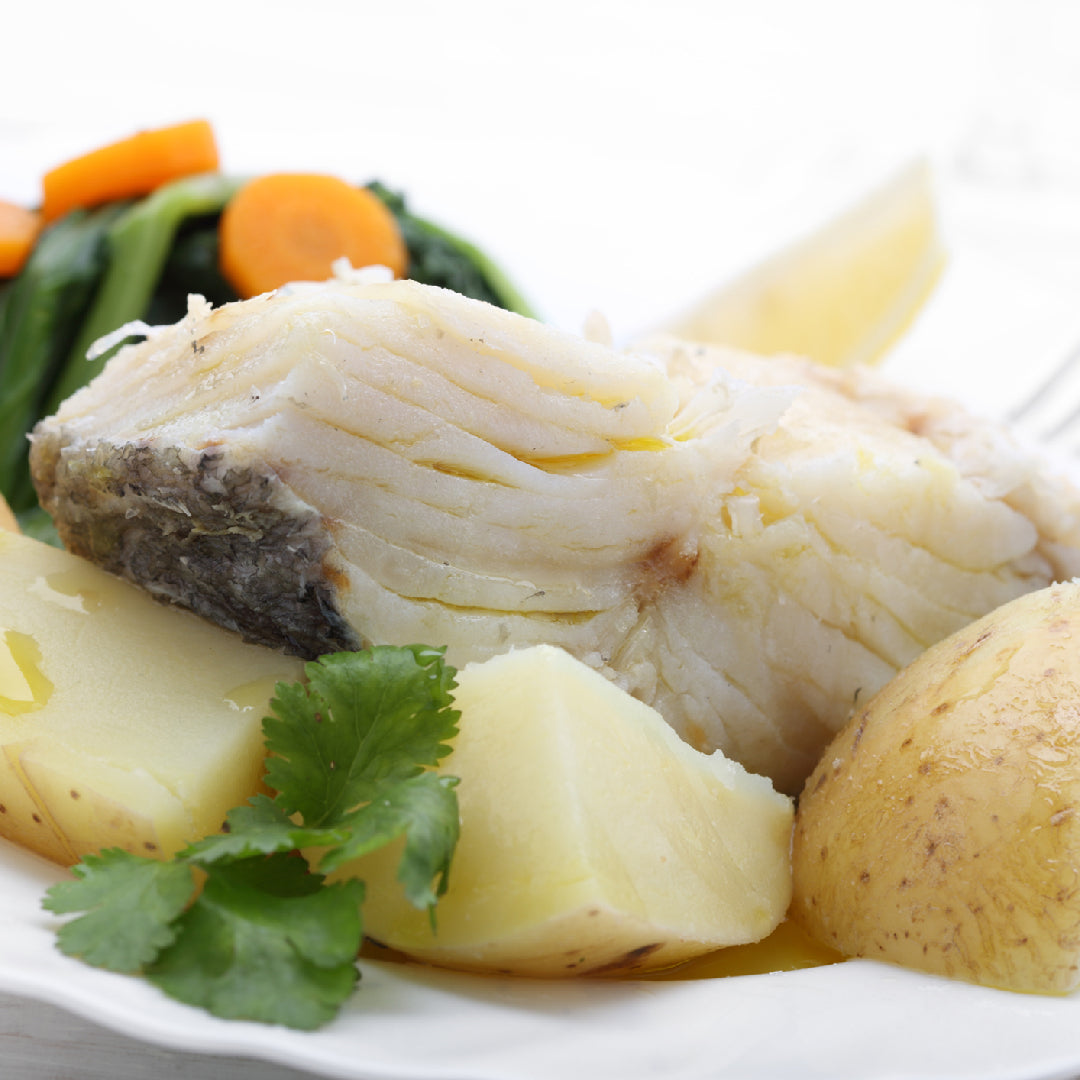 Pan-seared sablefish fillet with soy glaze, garnished with sesame seeds and scallions