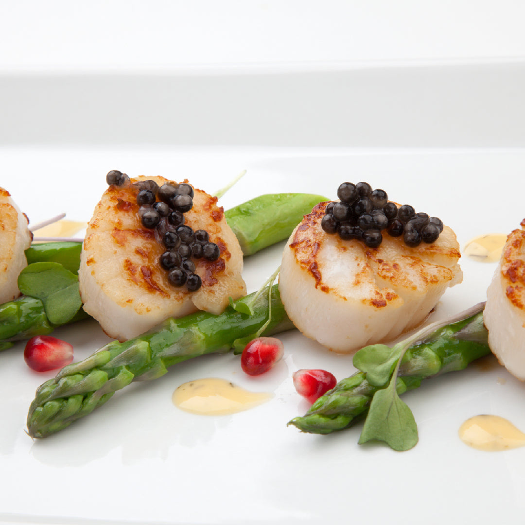 Pan-seared diver scallops with golden crust served with lemon butter sauce