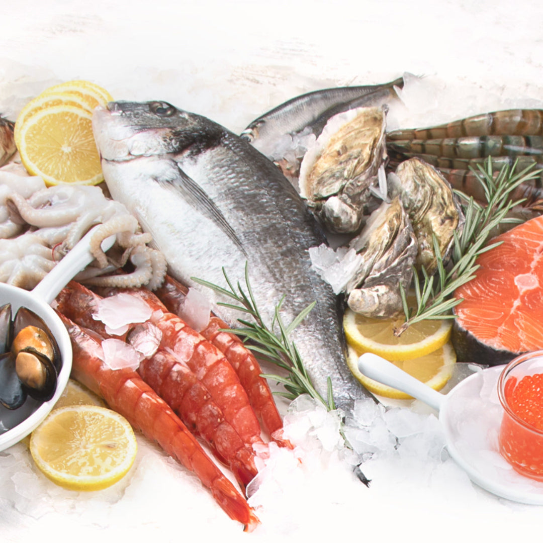 A premium seafood gift box with fresh lobster, salmon, and shrimp on a decorative presentation tray
