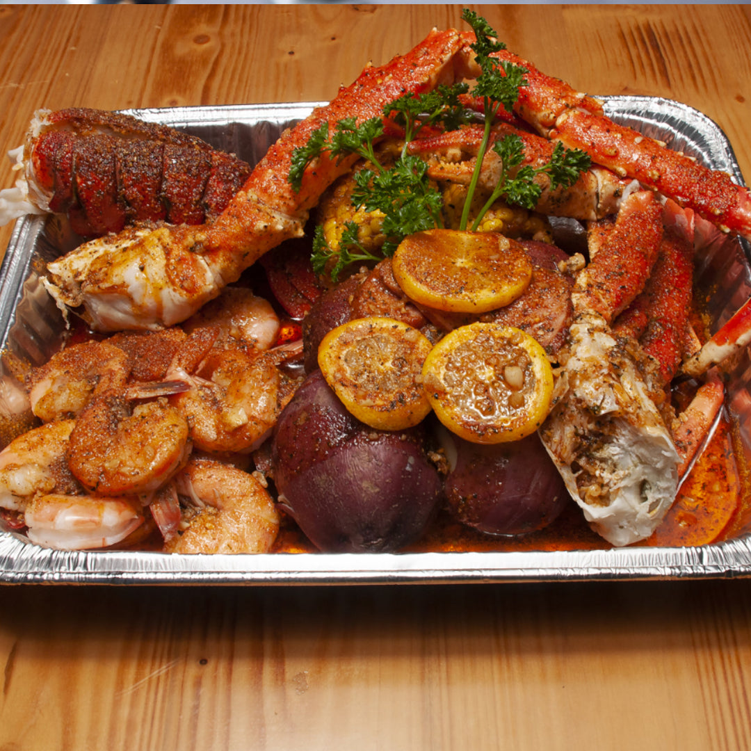Seafood platter with shrimp, crab legs, and lobster