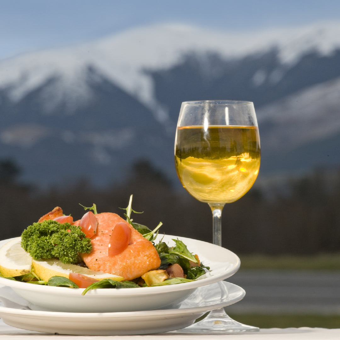 Child-friendly silver salmon nuggets served with dipping sauce on a colorful plate