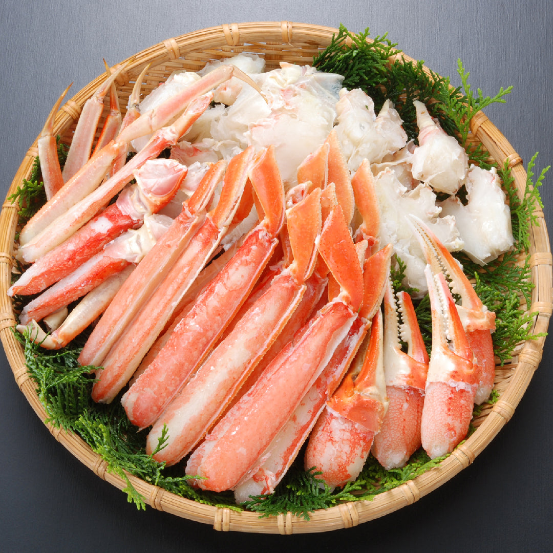 Snow crab leg clusters on ice ready for cooking with lemon and butter