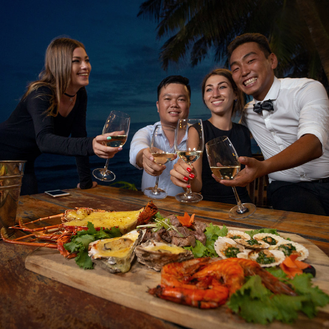 Fresh stone crab claws and oysters on a seafood platter at a Miami waterfront restaurant