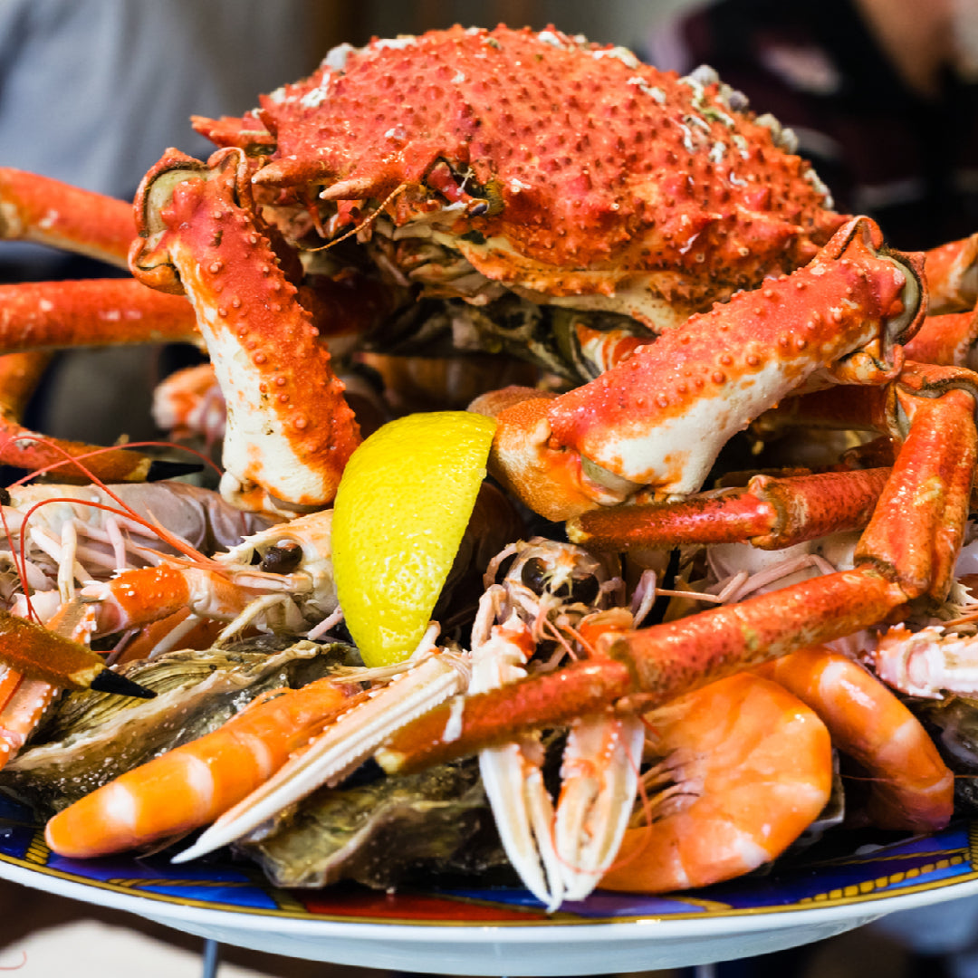 Fresh oysters and crab legs on a seafood platter at a Chicago restaurant