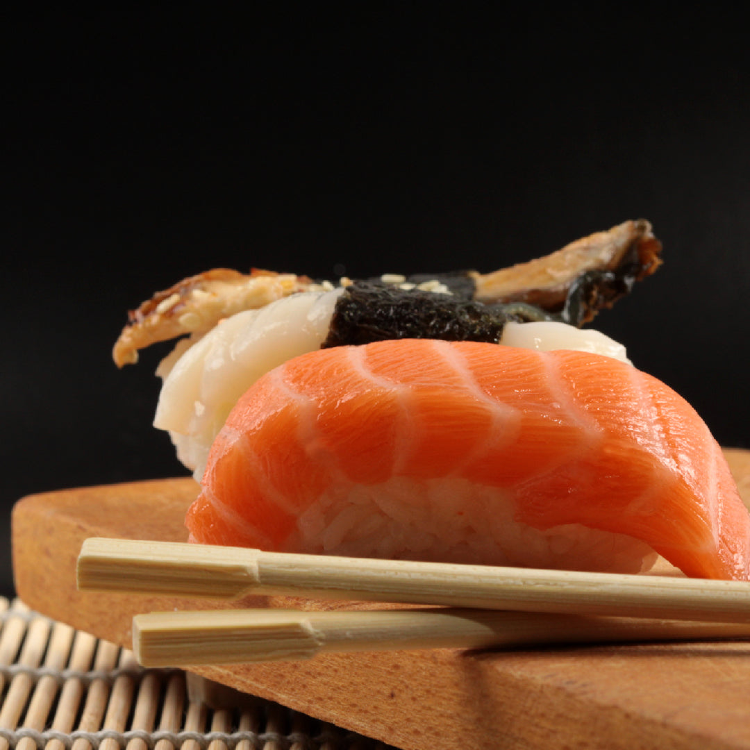 Assorted nigiri and sushi rolls on a wooden board at a top-rated NYC sushi restaurant