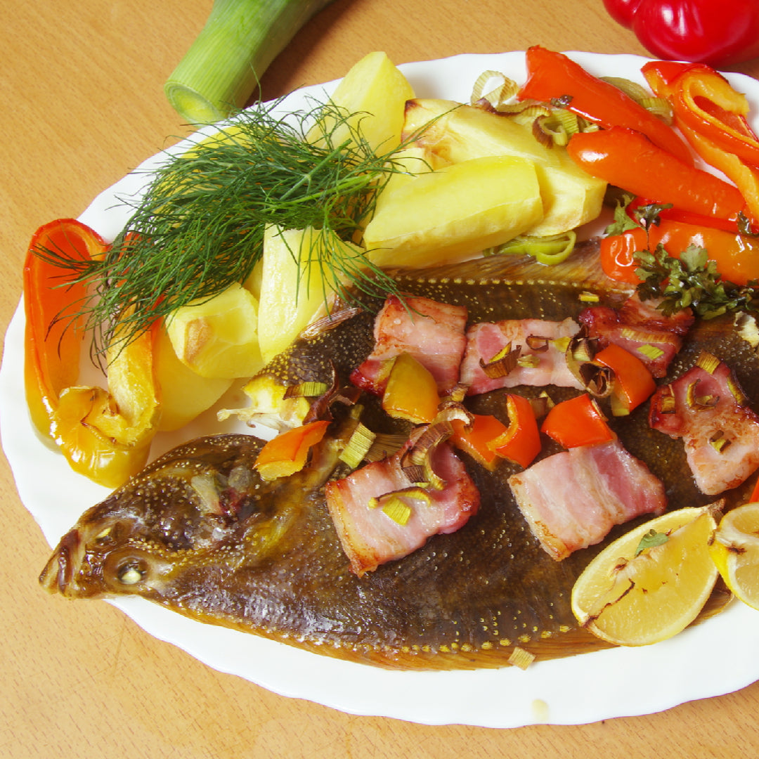 Five elegant Petrale sole dishes plated for a dinner party, including lemon butter, herb-crusted, and Mediterranean-style preparations