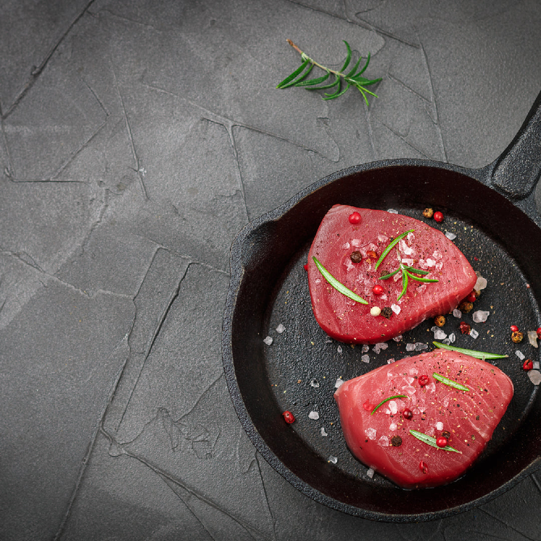 Fresh Ahi Tuna Poke Bowl with vibrant toppings and drizzled with savory sauce, capturing the essence of traditional Hawaiian cuisine
