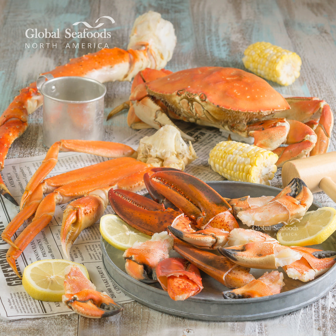 Side-by-side comparison of cooked King Crab and Dungeness Crab legs, showcasing their distinct sizes, colors, and textures
