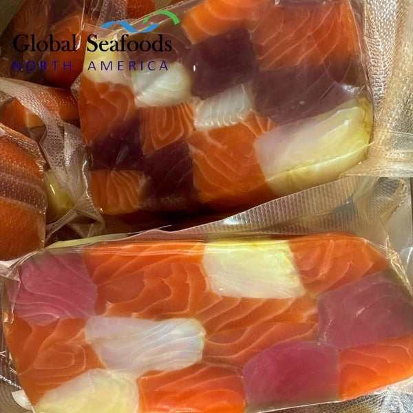 Cold smoked seafood rullet trio including halibut, king salmon, and yellowfin tuna slices, elegantly arranged for gourmet presentation