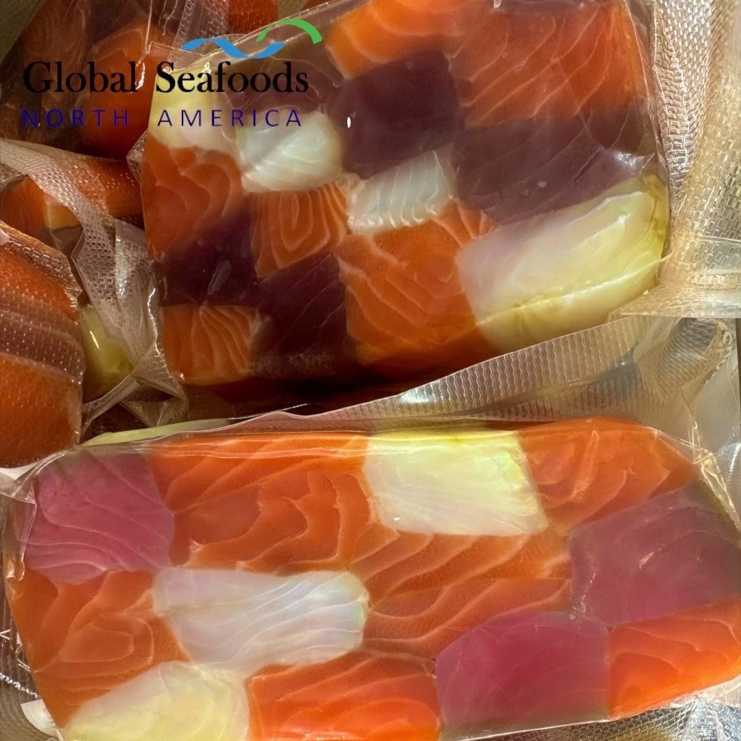 Cold smoked seafood rullet trio including halibut, king salmon, and yellowfin tuna slices, elegantly arranged for gourmet presentation