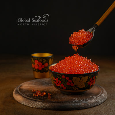 Decorative Russian bowl brimming with red salmon caviar, symbolizing festive and luxurious cuisine