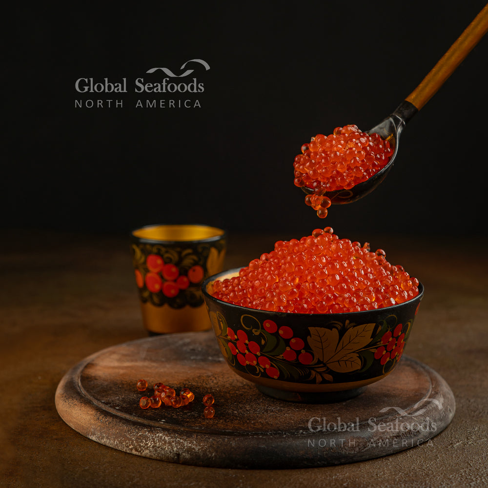 Decorative Russian bowl brimming with red salmon caviar, symbolizing festive and luxurious cuisine