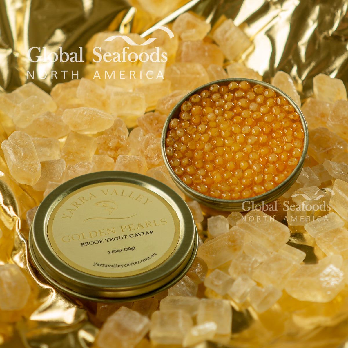 Open tin of Yarra Valley Golden Pearls brook trout caviar with its labeled lid on a gold background