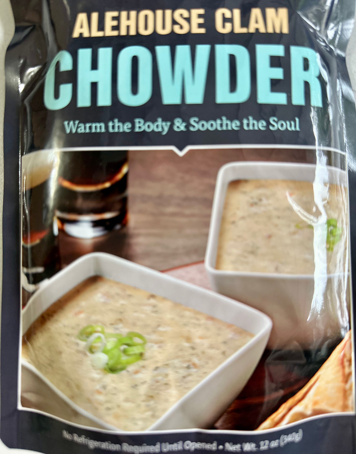 Alehouse Clam Chowder packaging beside soup and beer