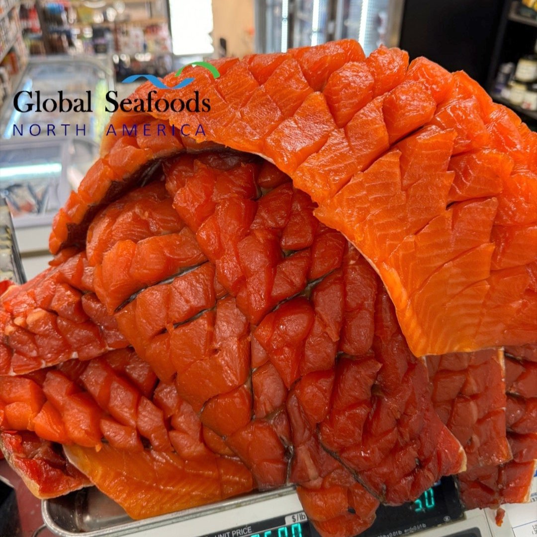 Pile of smoked salmon chunks arranged skin-on, Yakut-style, highlighting texture and artisanal preparation