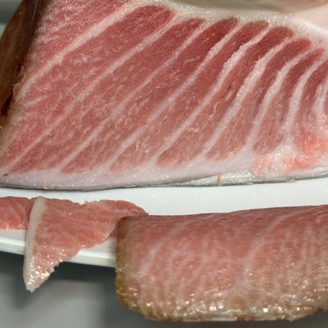 Premium dry-aged Bluefin tuna toro cuts, highlighting rich marbling and deep red color, ideal for high-end tuna dishes or sushi