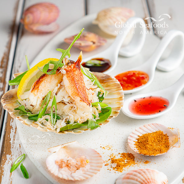 Dungeness crab meat over salad in a shell