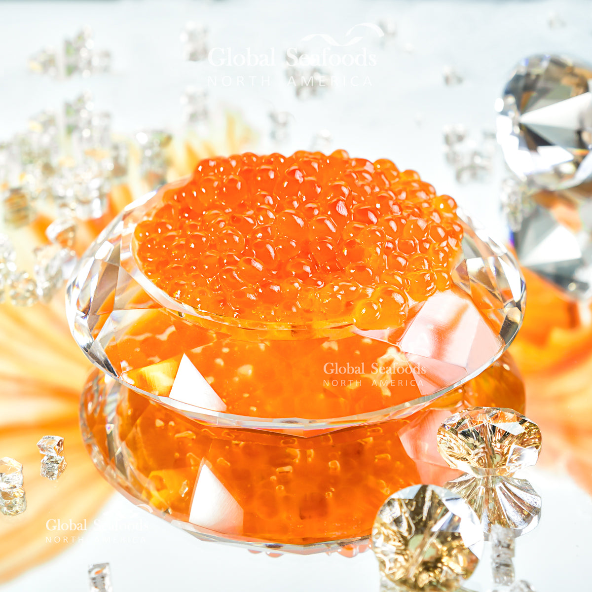 King salmon roe in a faceted glass bowl surrounded by decorative crystals