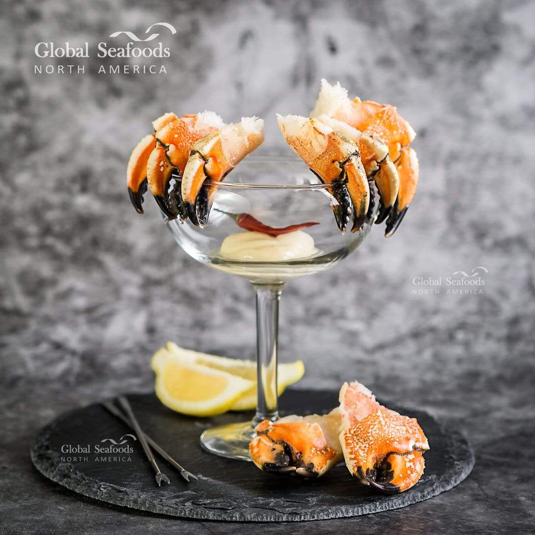 Pre-cut Jonah crab claws in a cocktail glass