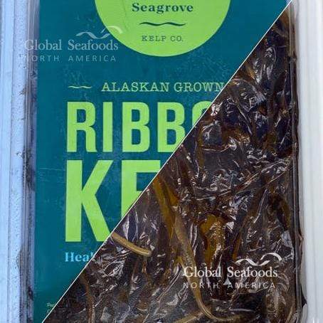 Fresh kelp packed in a clear plastic container, showcasing its green texture and ready-to-use form for culinary or nutritional purposes