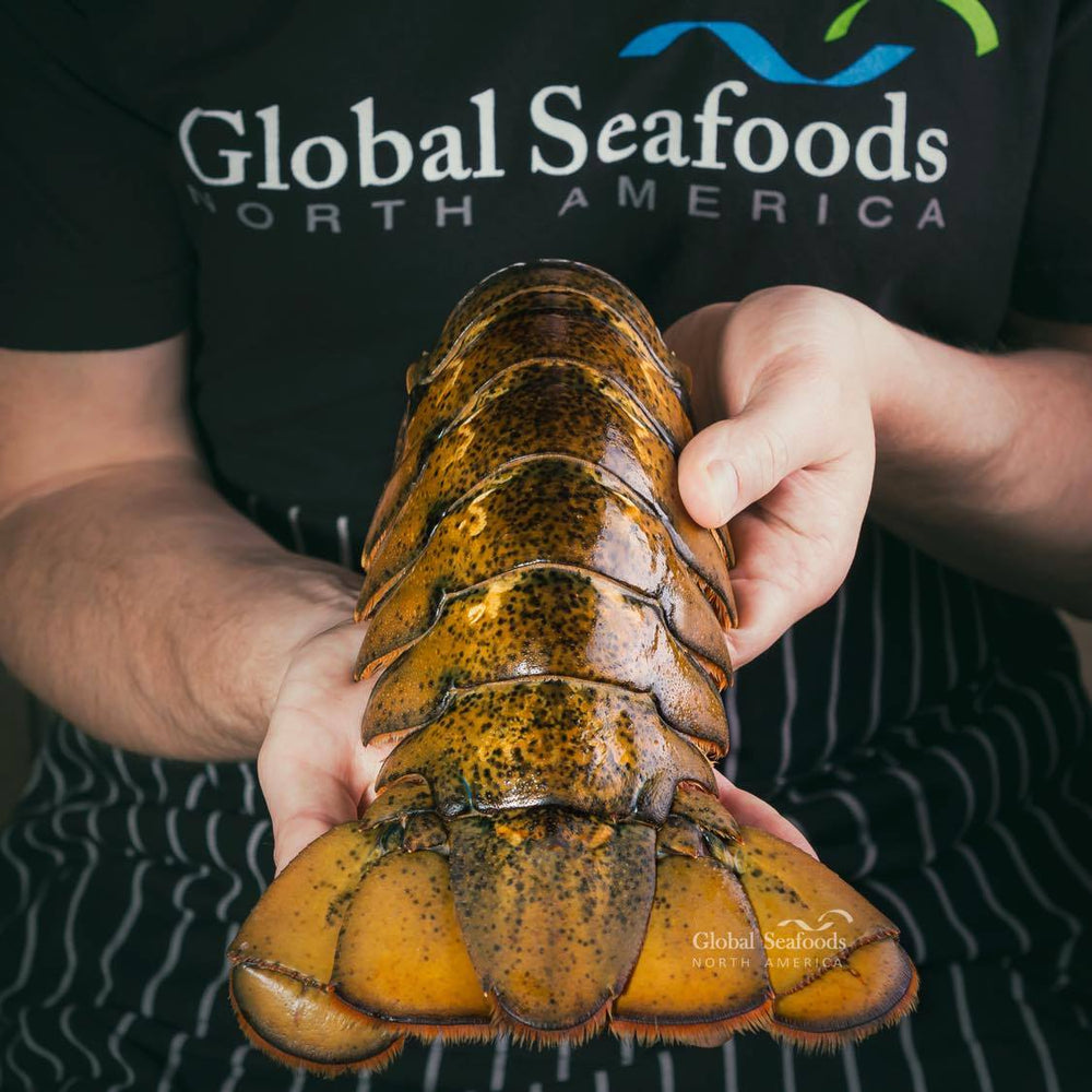 Large lobster tails held in two hands
