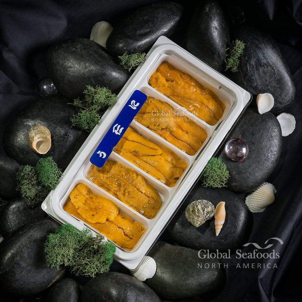 Uni (sea urchin roe) neatly arranged in a white plastic tray with five sections, showcasing its fresh golden color and premium sashimi-grade quality