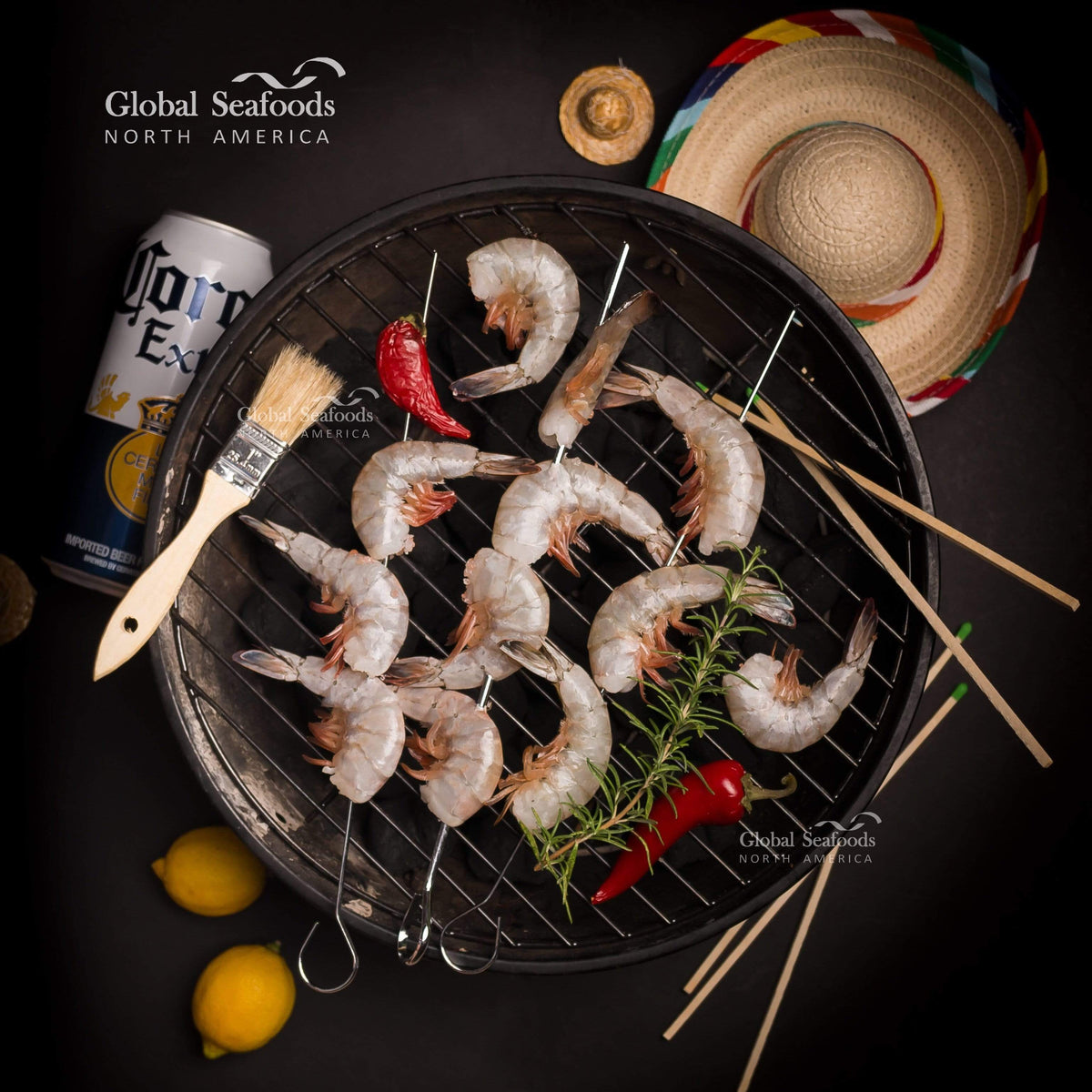 Uncooked shrimp skewers arranged on a grill with lemon