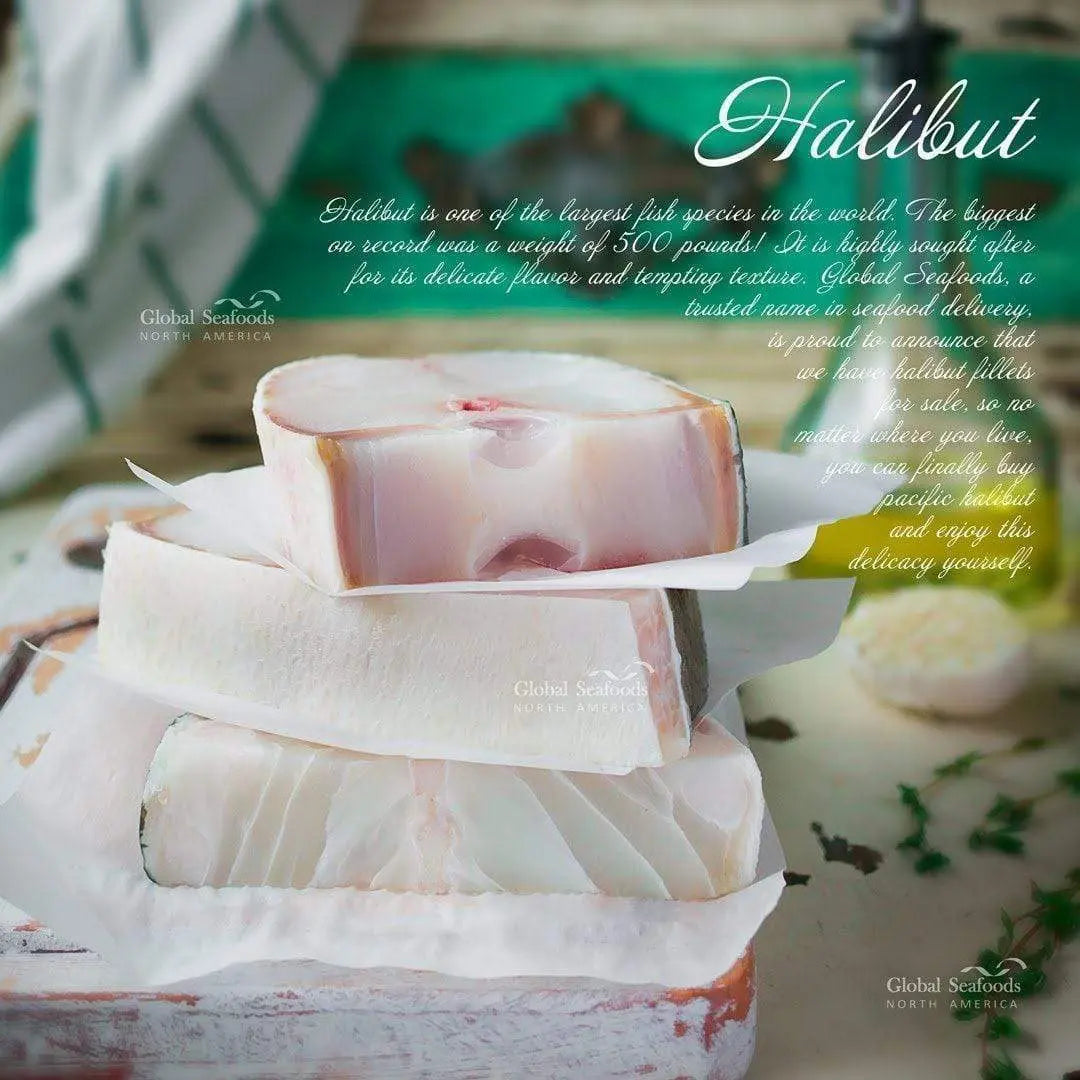 Three raw halibut steaks stacked with parchment between them.