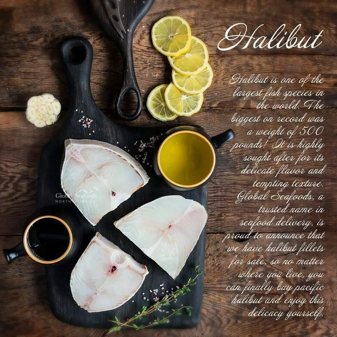 Three raw halibut steaks on a black board with lime slices and small bowls of oil and sauce.