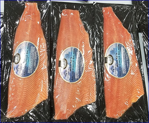 Three vacuum-packed Arctic Kotzebue keta salmon fillets with product labels